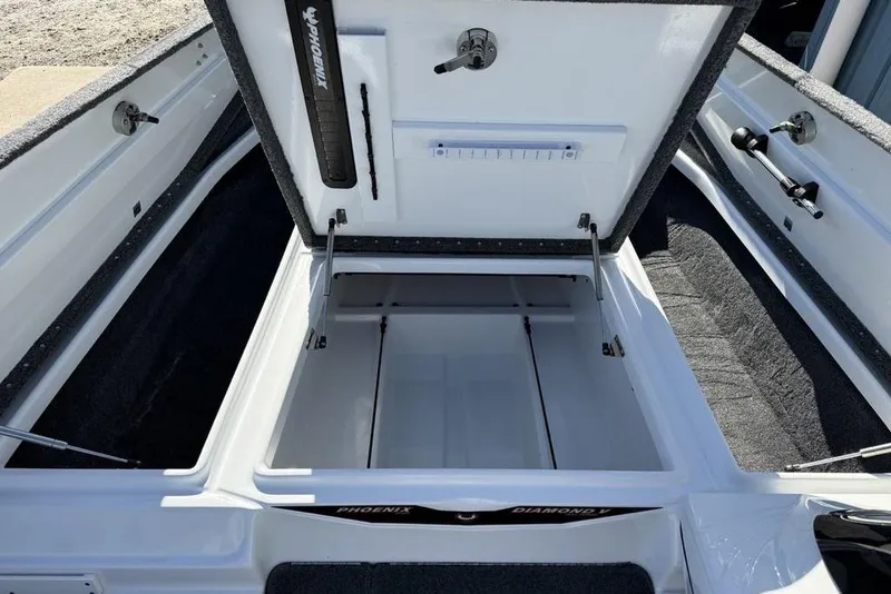 Slide: The Image of Open storage compartment of 2019 Phoenix 618 Pro boat, showcasing interior space and design. - 8