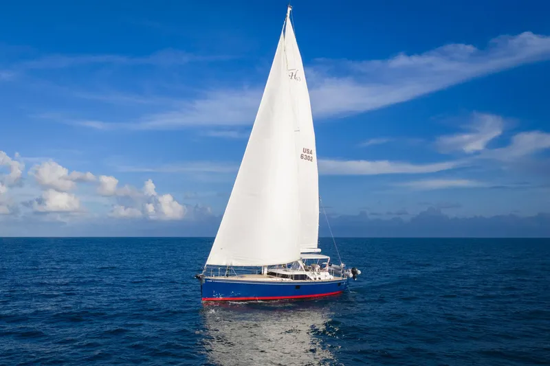 Slide: The Image of Sailing yacht Hylas 63, 2013 model, gliding on open ocean under clear blue sky. - 10