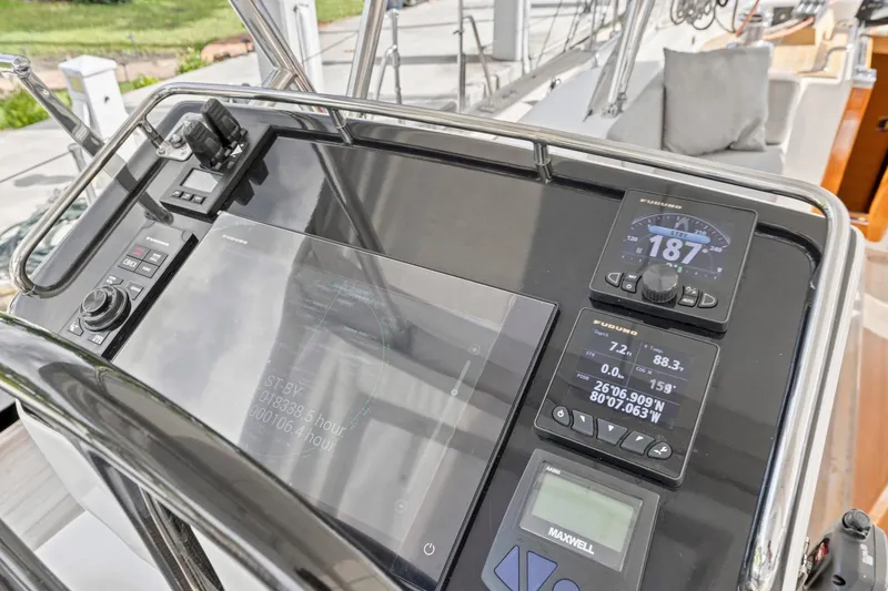 Slide: The Image of Cockpit of 2013 Hylas 63 yacht featuring navigation instruments and control panel. - 24