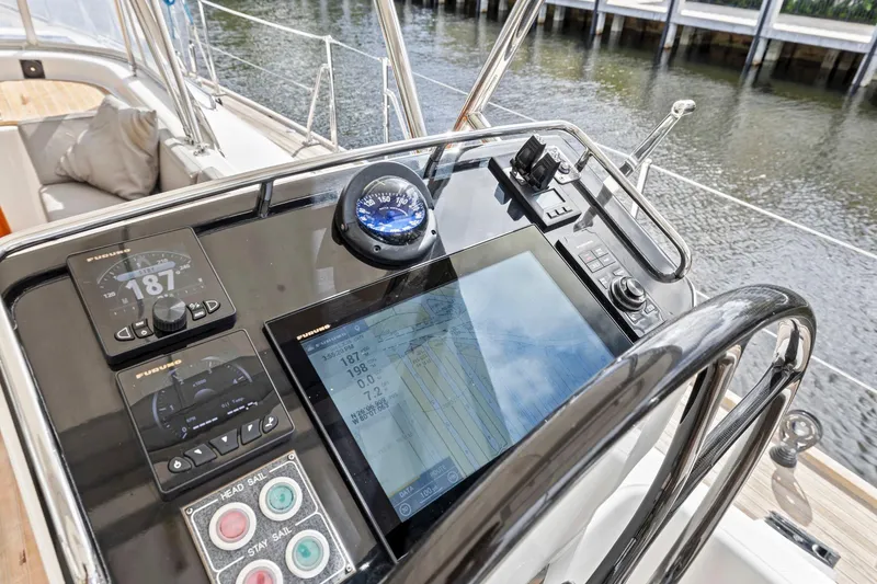 Slide: The Image of Helm of 2013 Hylas 63 yacht with navigation instruments and compass. - 25
