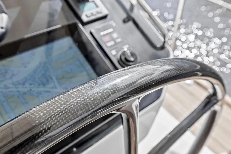 Slide: The Image of Carbon fiber helm of 2013 Hylas 63 yacht with navigation display. - 26