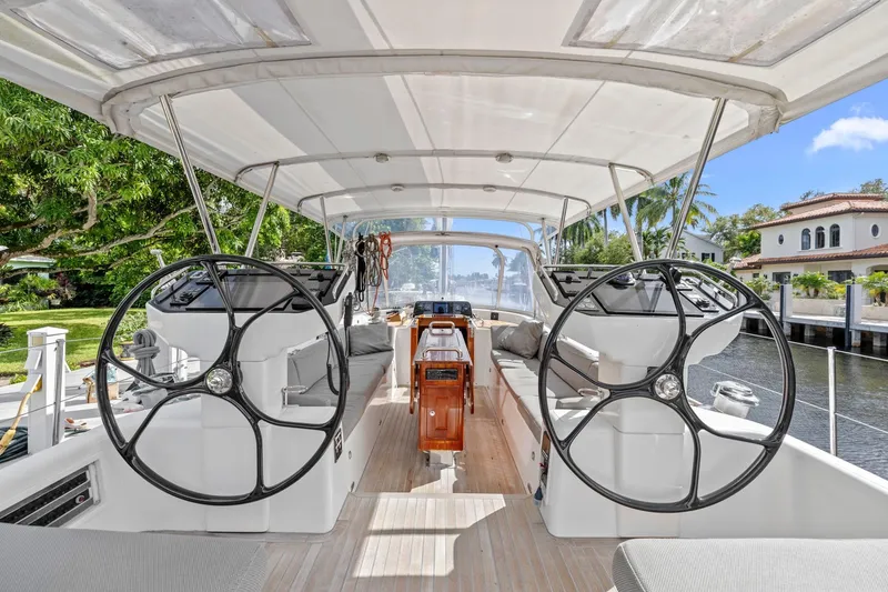 Slide: The Image of Spacious cockpit of 2013 Hylas 63 yacht with dual steering wheels and comfortable seating. - 3