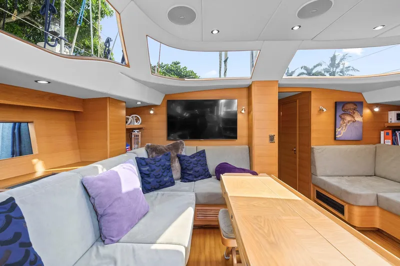 Slide: The Image of Luxurious interior of a 2013 Hylas 63 yacht with modern furnishings and large windows. - 42