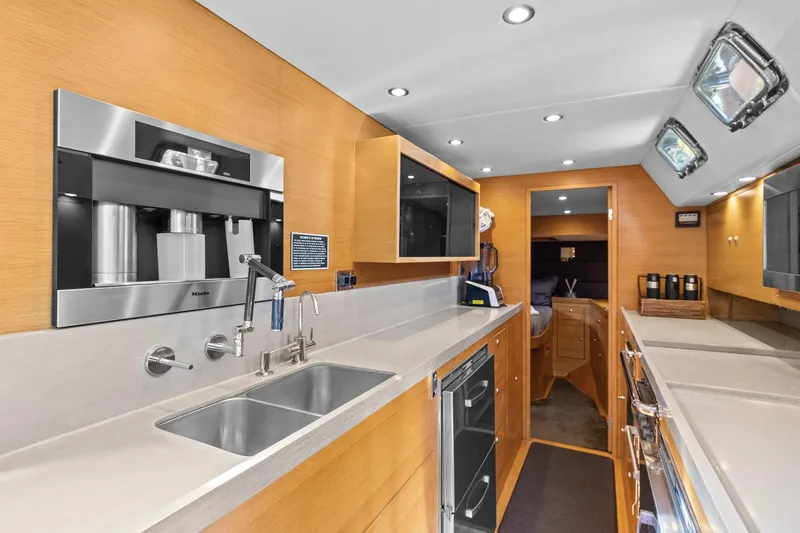Slide: The Image of Luxurious galley kitchen in 2013 Hylas 63 yacht with modern appliances and sleek design. - 48