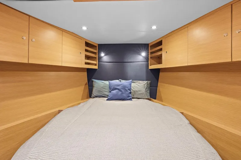 Slide: The Image of Luxurious cabin interior of 2013 Hylas 63 yacht with cozy bedding and wooden cabinetry. - 50