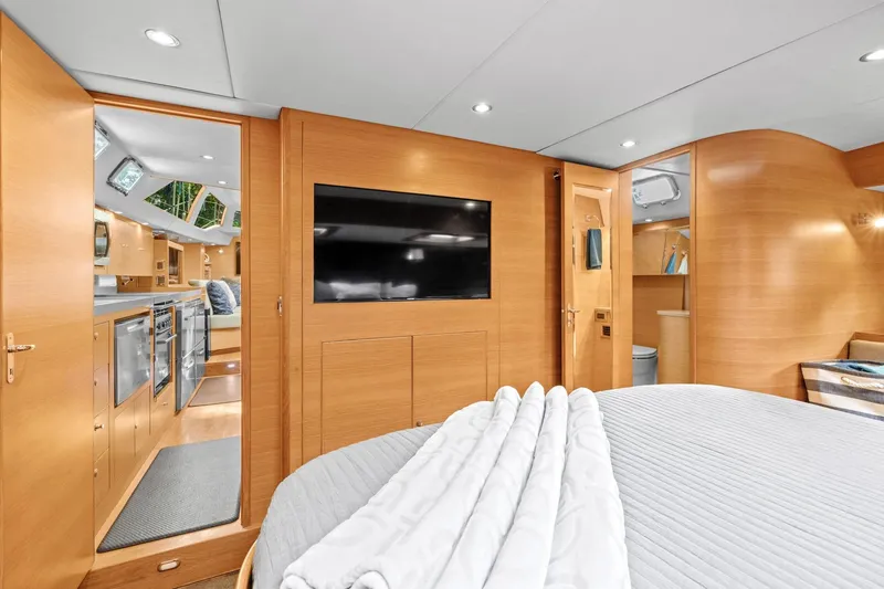 Slide: The Image of Luxurious interior of 2013 Hylas 63 yacht with modern amenities and elegant wood finish. - 53