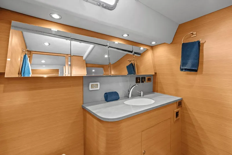 Slide: The Image of Luxurious bathroom interior of 2013 Hylas 63 yacht with modern fixtures and wooden finish. - 55
