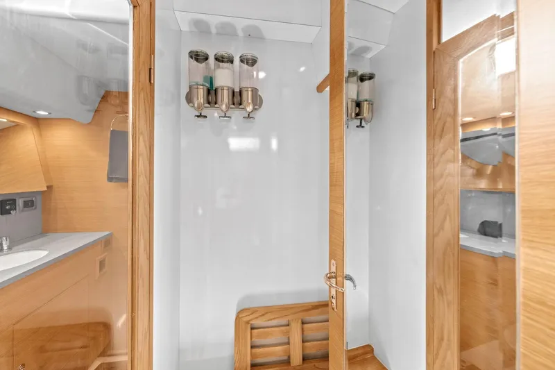 Slide: The Image of Luxurious 2013 Hylas 63 yacht bathroom with wooden accents and modern fixtures. - 57