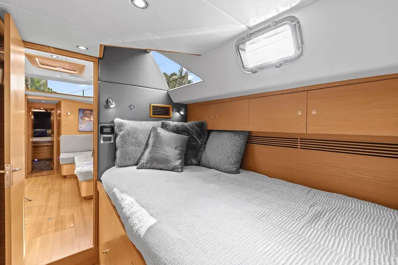 Slide: The Image of Luxurious cabin interior of a 2013 Hylas 63 yacht with modern wood finishes. - 58