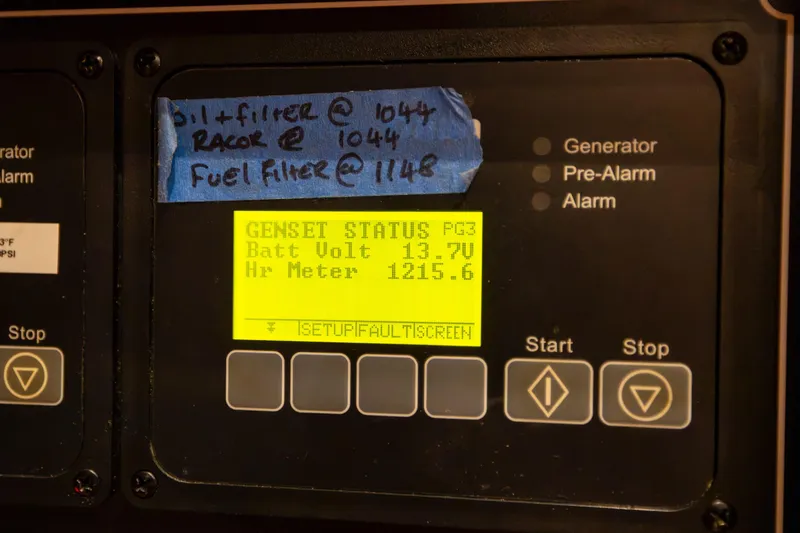 Slide: The Image of Control panel of a 2013 Hylas 63 yacht showing generator status and maintenance notes. - 63