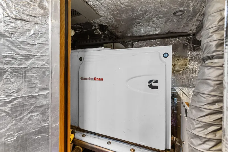 Slide: The Image of Cummins Onan generator in a 2013 Hylas 63 yacht engine room. - 68
