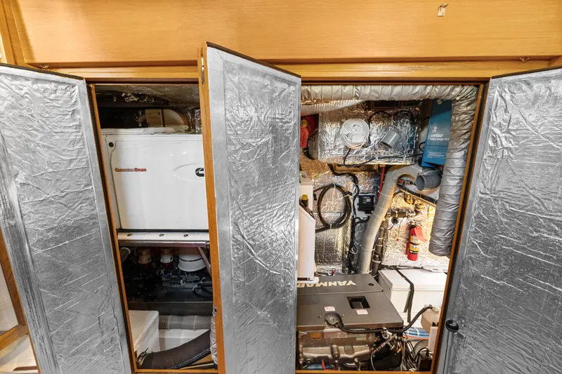Slide: The Image of Engine room of 2013 Hylas 63 yacht with Cummins Onan generator and Yanmar engine. - 69
