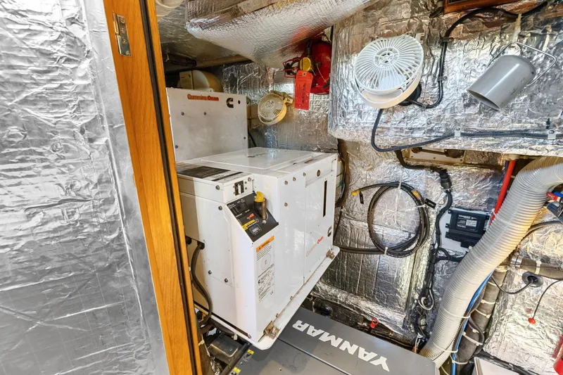 Slide: The Image of Engine room of 2013 Hylas 63 yacht with Cummins Onan generator and Yanmar equipment. - 70