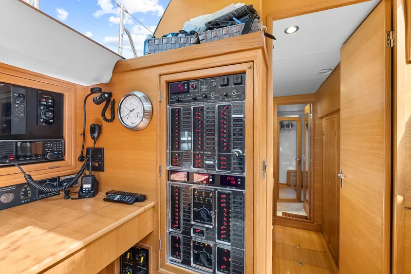 Slide: The Image of Control panel and navigation equipment inside a 2013 Hylas 63 yacht cabin. - 71