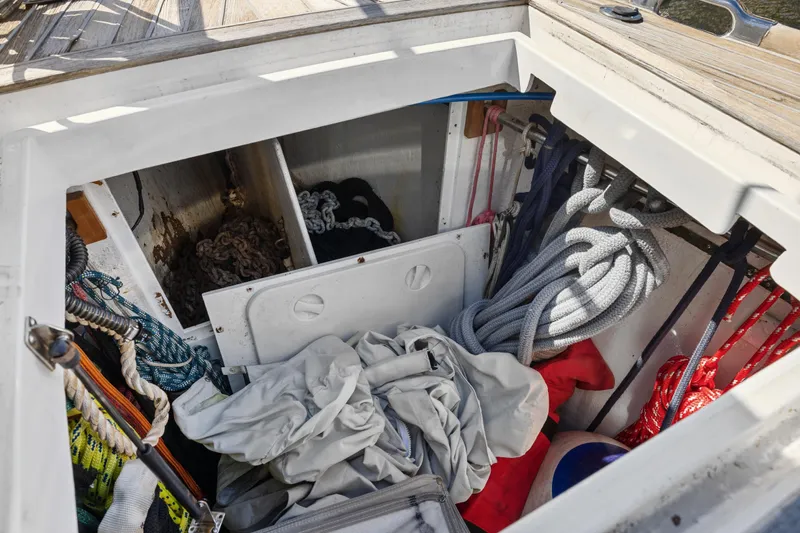 Slide: The Image of Storage compartment on a 2013 Hylas 63 yacht with ropes and equipment. - 72