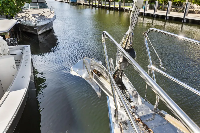Slide: The Image of Bow of a 2013 Hylas 63 yacht docked in a marina. - 73