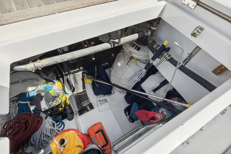 Slide: The Image of Storage compartment of a 2013 Hylas 63 yacht with ropes and equipment. - 74