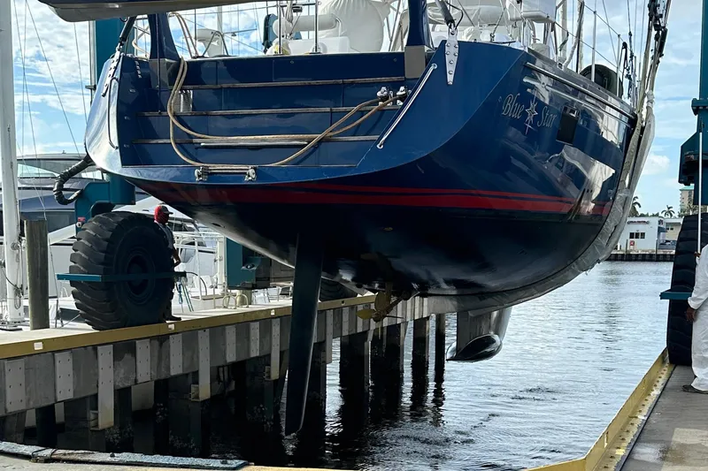 Slide: The Image of Hylas 63 yacht from 2013 being lifted at a marina dock. - 81