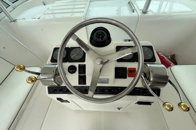 Slide: The Image of Steering console of 2003 Luhrs 32 Open boat with gauges and controls. - 6