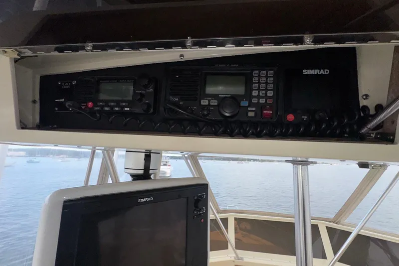 Slide: The Image of 1986 Viking 35 Convertible boat with Simrad navigation equipment and radio controls. - 14