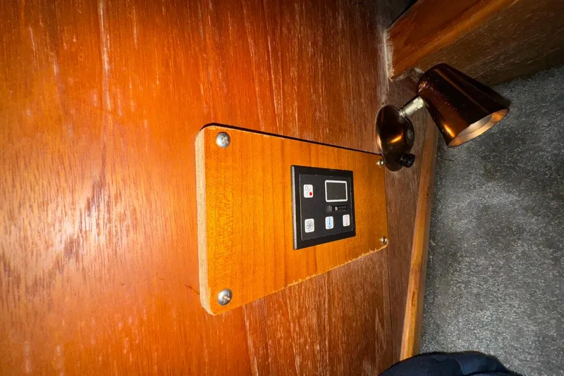 Slide: The Image of Control panel and light fixture on 1986 Viking 35 Convertible boat interior. - 25