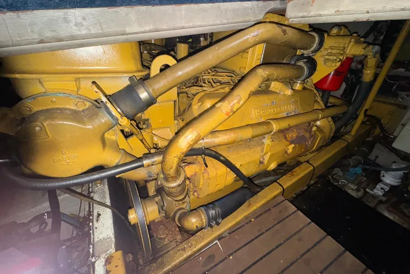 Slide: The Image of Engine of a 1986 Viking 35 Convertible boat, showcasing mechanical components. - 43