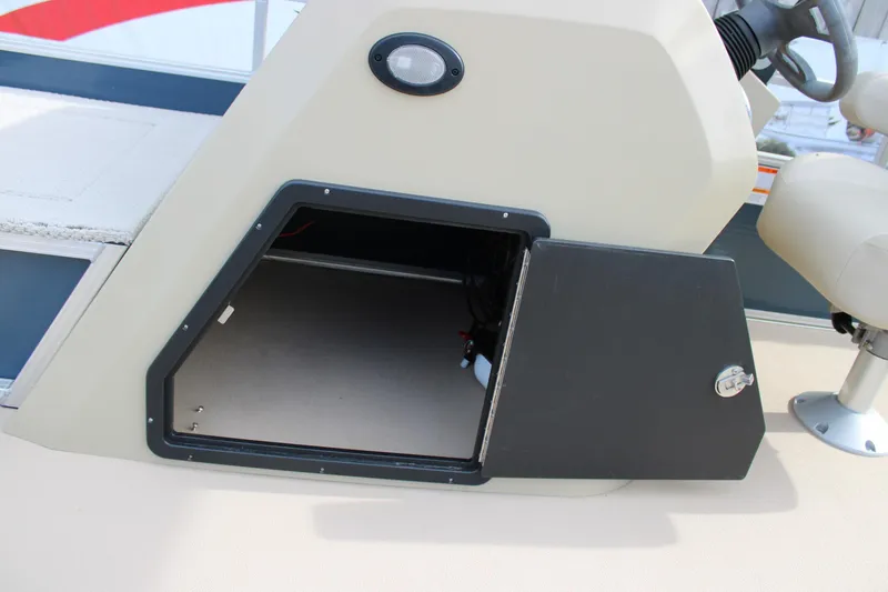 Slide: The Image of 2016 Lowe Ultra 182 Fish & Cruise boat storage compartment with open door. - 12