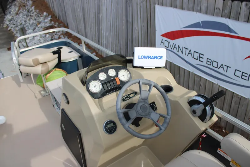 Slide: The Image of 2016 Lowe Ultra 182 Fish & Cruise boat dashboard with steering wheel and gauges. - 13