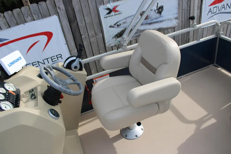 Slide: The Image of 2016 Lowe Ultra 182 Fish & Cruise boat interior with steering wheel and captain's chair. - 14