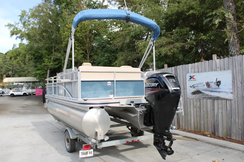 Slide: The Image of 2016 Lowe Ultra 182 Fish & Cruise pontoon boat with Mercury outboard motor on trailer. - 3