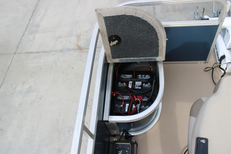 Slide: The Image of 2016 Lowe Ultra 182 Fish & Cruise boat battery compartment with open hatch. - 7