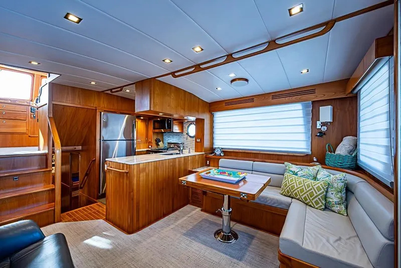 Slide: The Image of Luxurious 2019 Kadey-Krogen 44 AE yacht interior with modern kitchen and cozy seating area. - 11