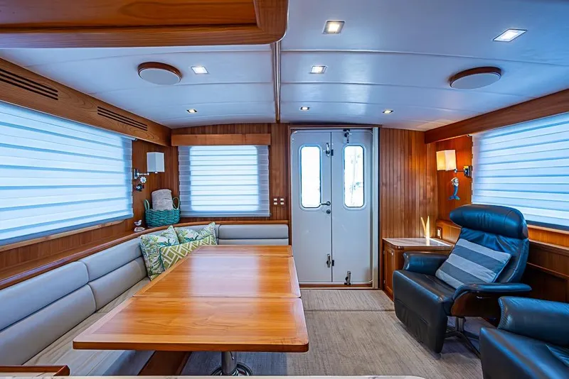 Slide: The Image of Luxurious interior of 2019 Kadey-Krogen 44 AE yacht with elegant seating and wooden accents. - 12