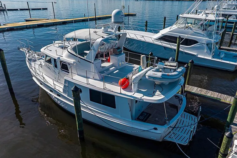 Slide: The Image of 2019 Kadey-Krogen 44 AE yacht docked at marina, aerial view. - 2