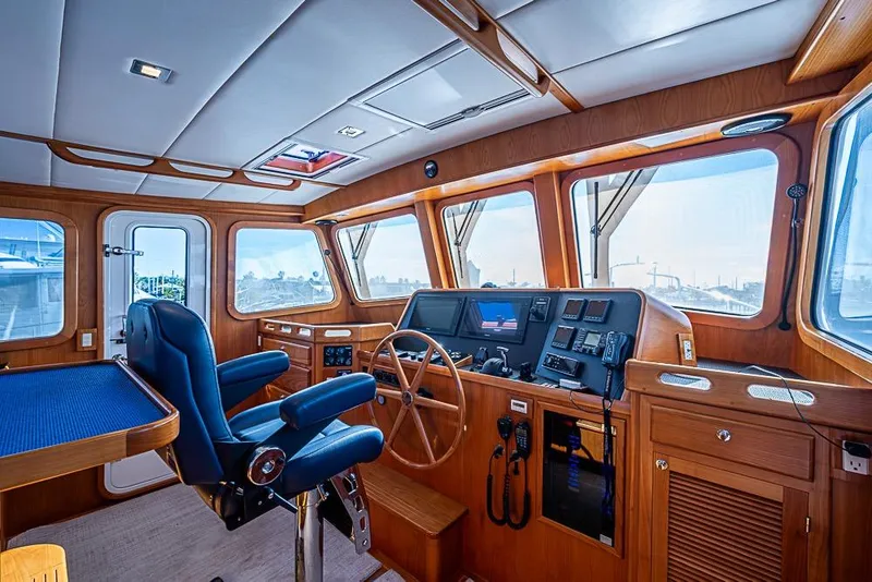 Slide: The Image of Pilothouse of 2019 Kadey-Krogen 44 AE yacht with navigation equipment and captain's chair. - 22