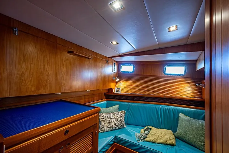 Slide: The Image of Luxurious interior of 2019 Kadey-Krogen 44 AE yacht with cozy seating and wooden finishes. - 33