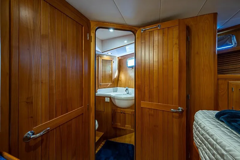 Slide: The Image of Luxurious wooden interior of 2019 Kadey-Krogen 44 AE yacht bathroom. - 34