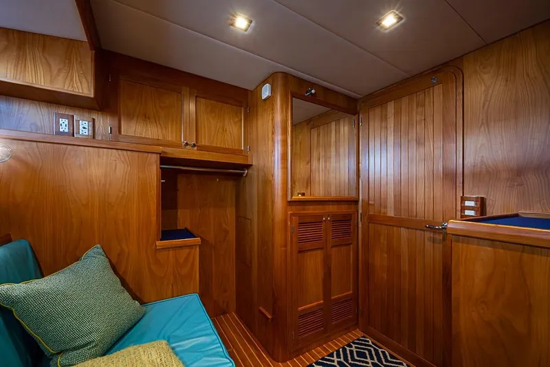 Slide: The Image of 2019 Kadey-Krogen 44 AE yacht interior with wooden cabinetry and seating area. - 39