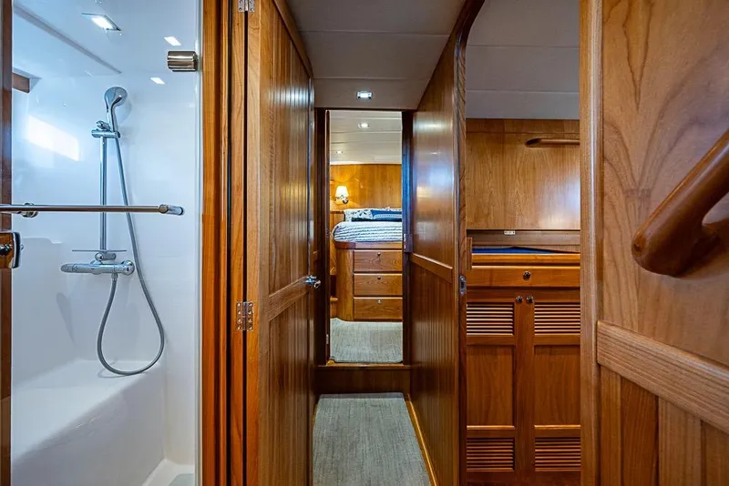 Slide: The Image of 2019 Kadey-Krogen 44 AE yacht interior with wooden cabinetry and modern shower. - 43