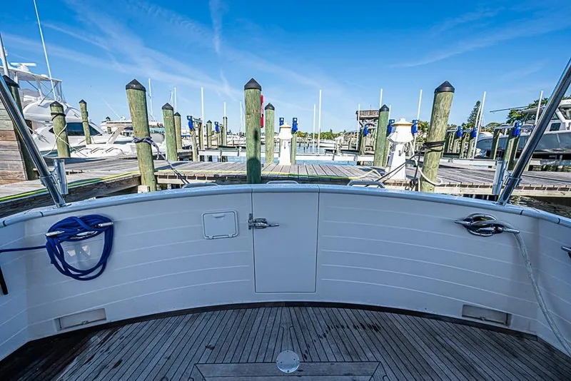 Slide: The Image of 2019 Kadey-Krogen 44 AE yacht docked at a marina under clear blue skies. - 47