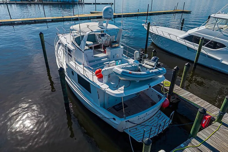 Slide: The Image of 2019 Kadey-Krogen 44 AE yacht docked at marina, aerial view. - 5
