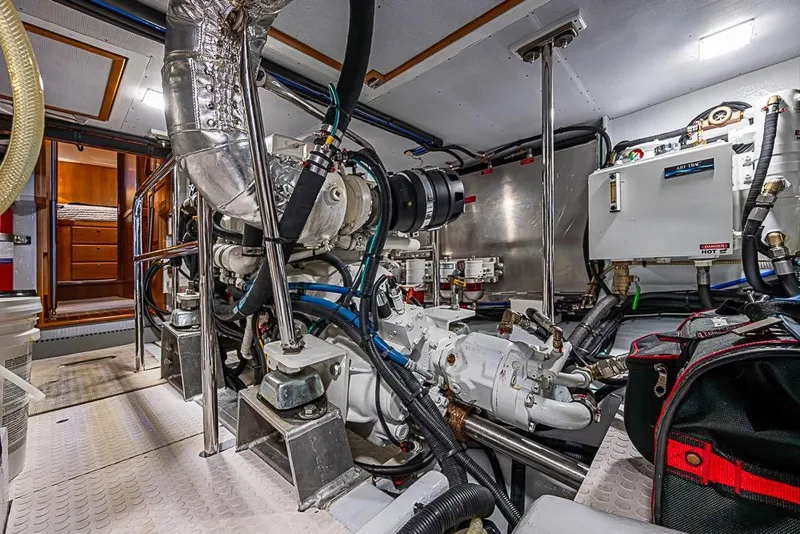 Slide: The Image of Engine room of 2019 Kadey-Krogen 44 AE yacht, showcasing mechanical components and equipment. - 61