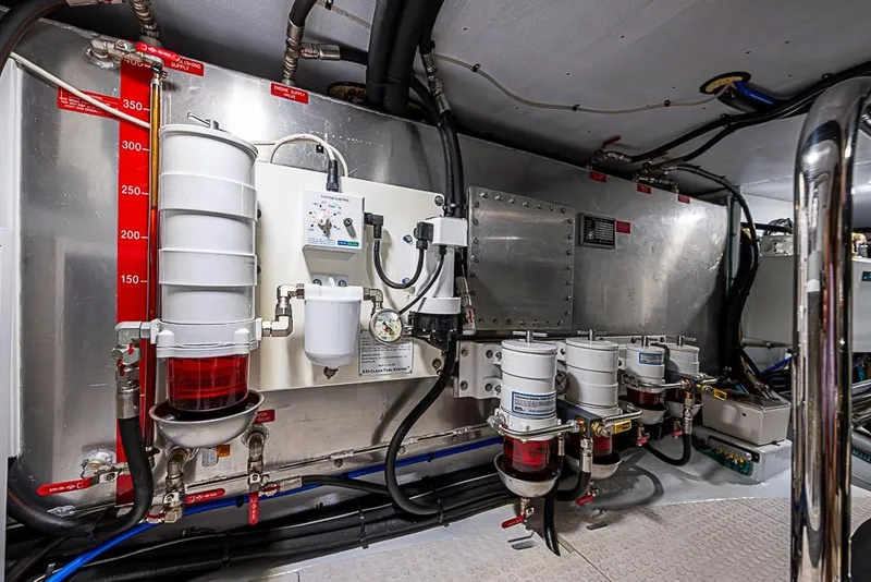 Slide: The Image of Engine room of 2019 Kadey-Krogen 44 AE yacht, featuring fuel filtration system and control panel. - 70