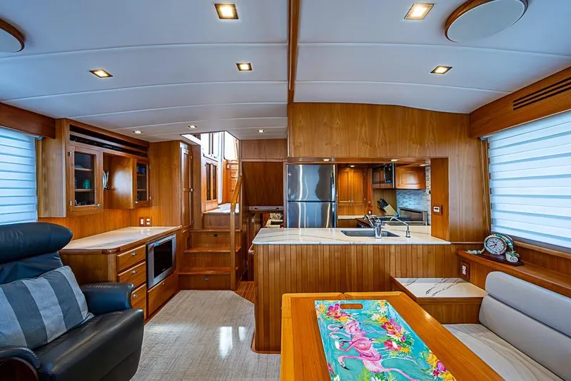 Slide: The Image of Luxurious 2019 Kadey-Krogen 44 AE yacht interior with modern kitchen and elegant wood finishes. - 10
