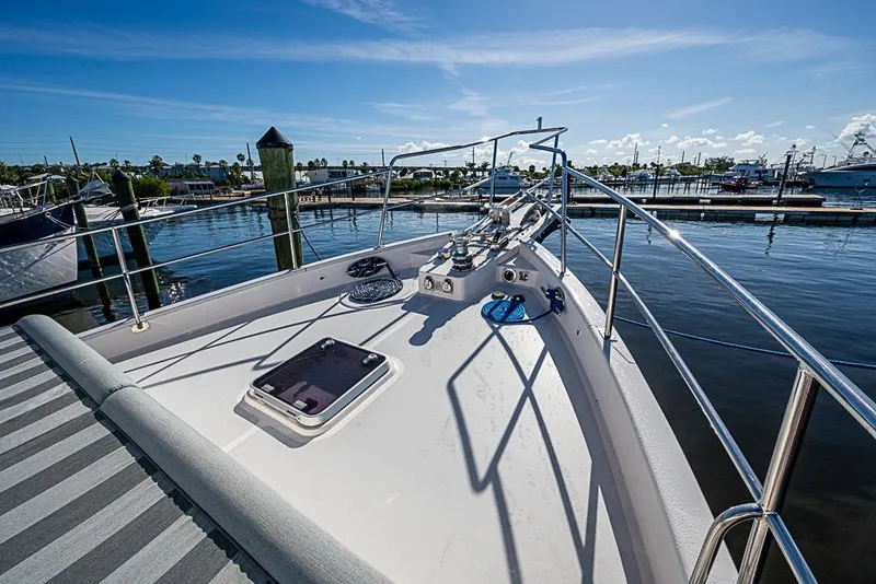 Slide: The Image of 2019 Kadey-Krogen 44 AE yacht bow view at marina under clear blue sky. - 49