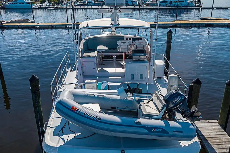Slide: The Image of Kadey-Krogen 44 AE 2019 yacht with dinghy at marina dock. - 6