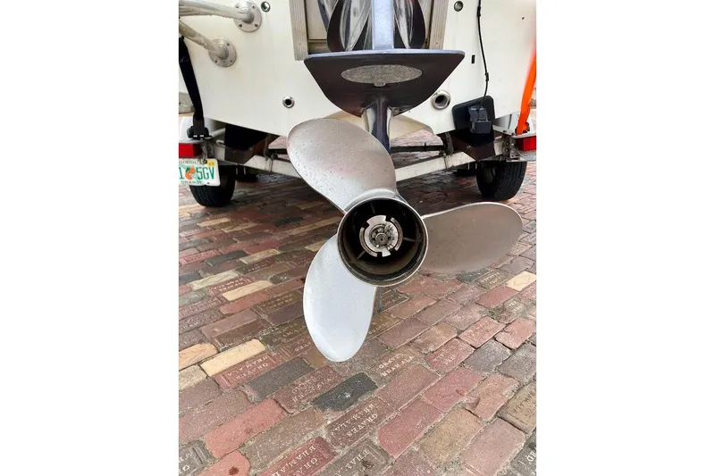 Slide: The Image of 2007 Action Craft Coastal Bay 2310 boat propeller on brick pavement. - 10