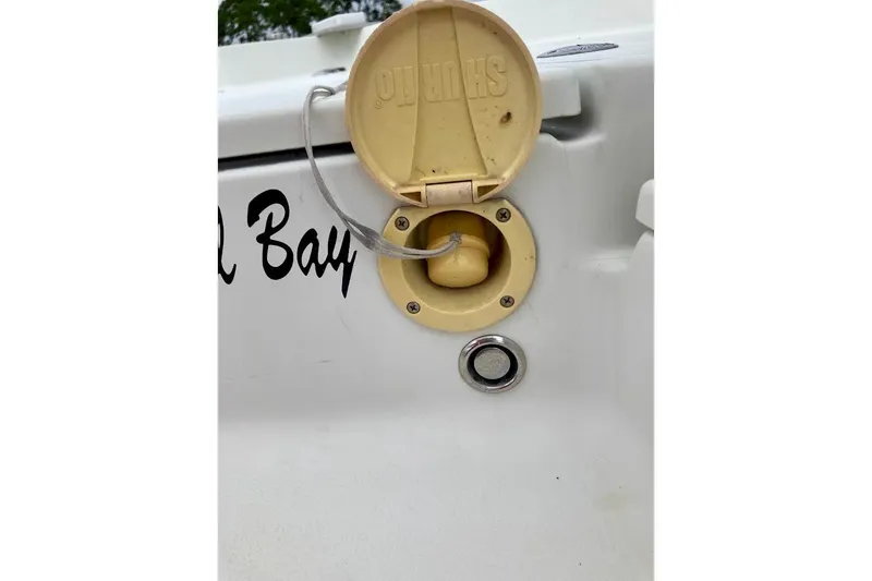 Slide: The Image of 2007 Action Craft Coastal Bay 2310 boat fuel cap and vent detail. - 30