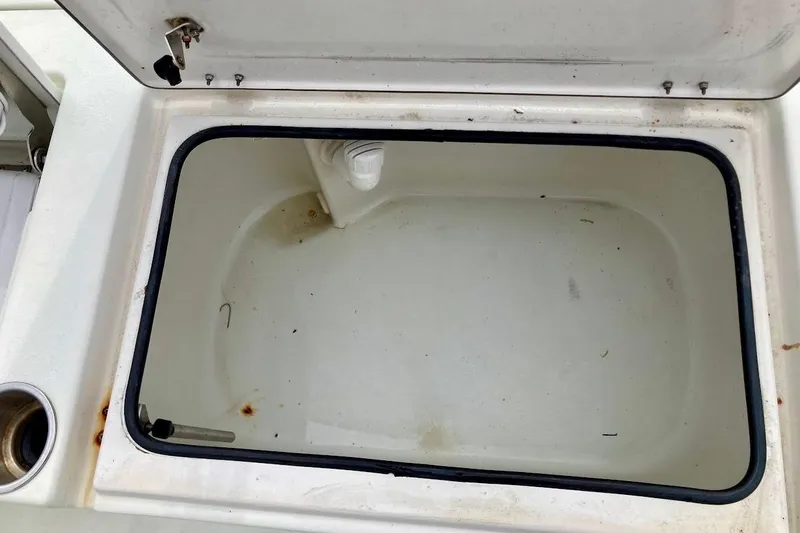 Slide: The Image of Open storage compartment on 2007 Action Craft Coastal Bay 2310 boat. - 37