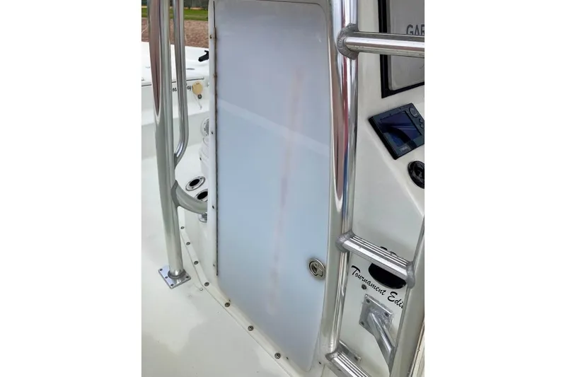 Slide: The Image of 2007 Action Craft Coastal Bay 2310 boat console with stainless steel railings. - 39
